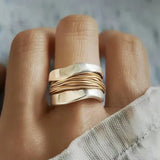 Silver ring with gold thread