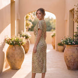 Midi dress with shaping effect, central knot, and fluid drape