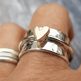 Silver ring with gold heart