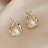 Vintage drop earrings with cross and triangle-shaped pearl