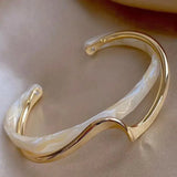 Elegant gold bracelet with white opal